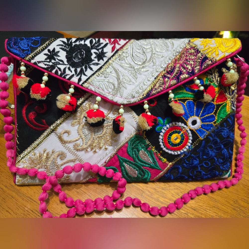 Handmade patch worked embroidered handbag. Made in India.
